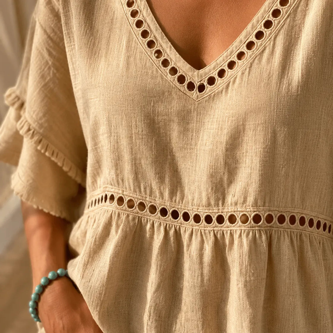 Meloria – Bohemian Babydoll Top with Eyelet Cutouts and Fringe Hem